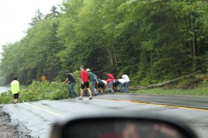 Racers dragging a tree out of Rt 28 on the way to registration.